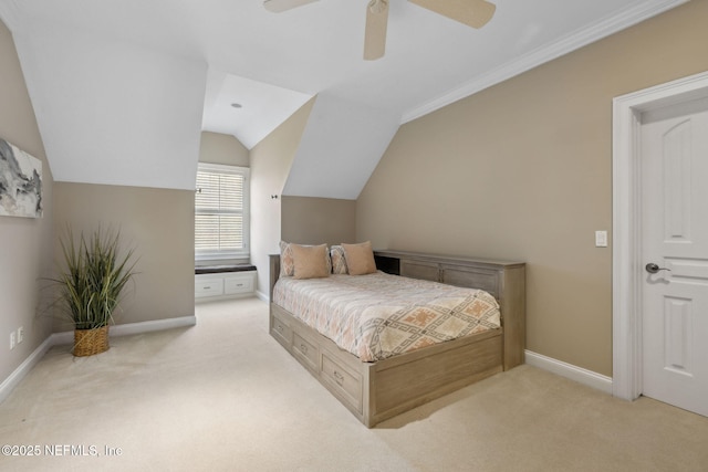 bedroom with vaulted ceiling, carpet floors, a ceiling fan, and baseboards