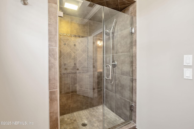 full bath with a shower stall