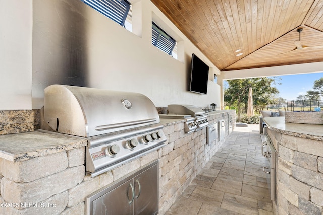 view of patio with an outdoor kitchen and grilling area