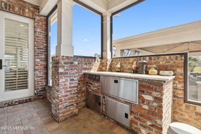 view of patio / terrace featuring exterior kitchen