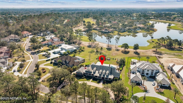 bird's eye view featuring a water view and a residential view