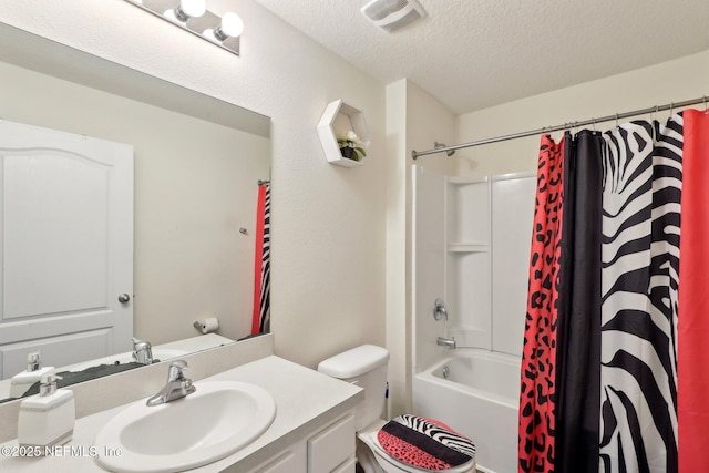 full bathroom featuring visible vents, toilet, shower / bathtub combination with curtain, a textured ceiling, and vanity