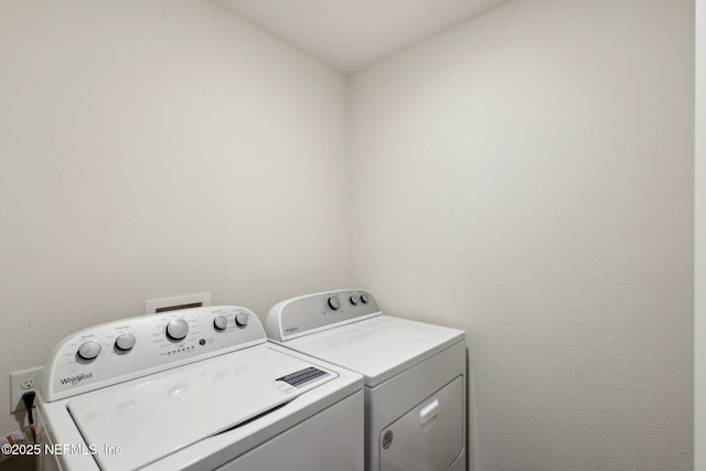 laundry area featuring laundry area and washer and clothes dryer