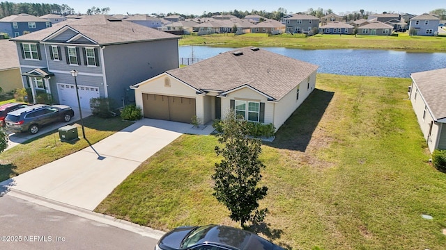 bird's eye view with a water view and a residential view