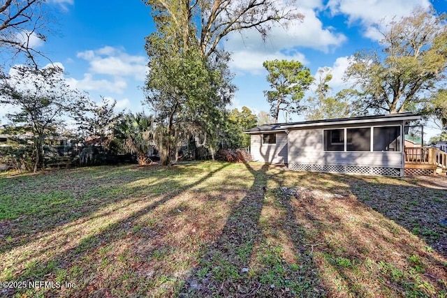 view of yard with a sunroom