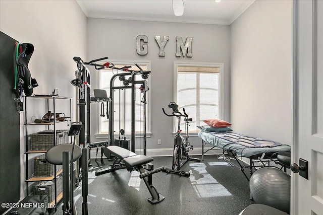 workout area with ornamental molding and baseboards