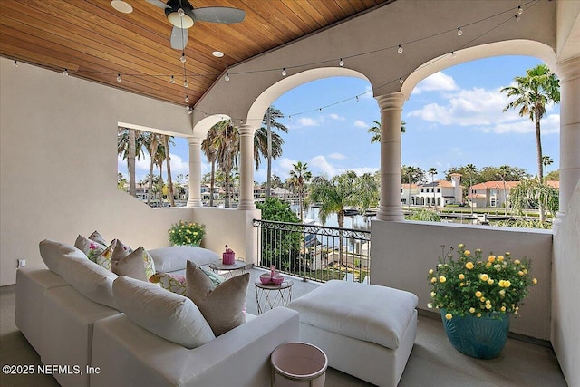 balcony with a residential view, ceiling fan, and an outdoor hangout area