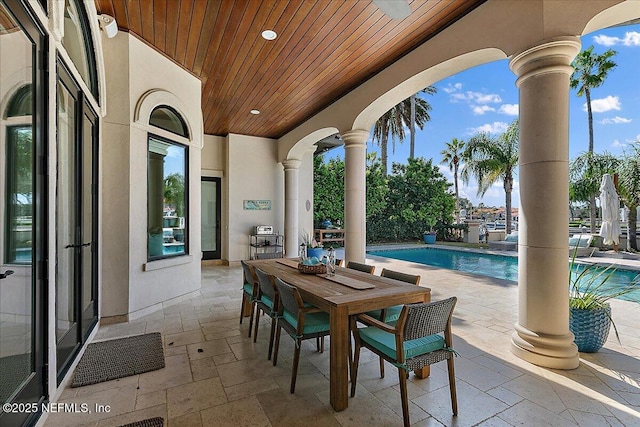 view of patio / terrace featuring an outdoor pool and outdoor dining space