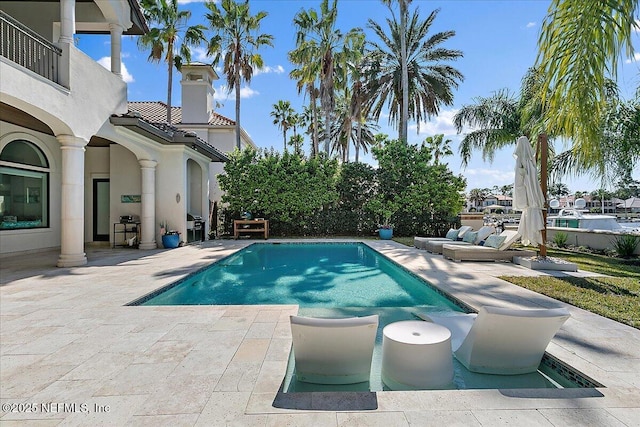 pool featuring a patio area