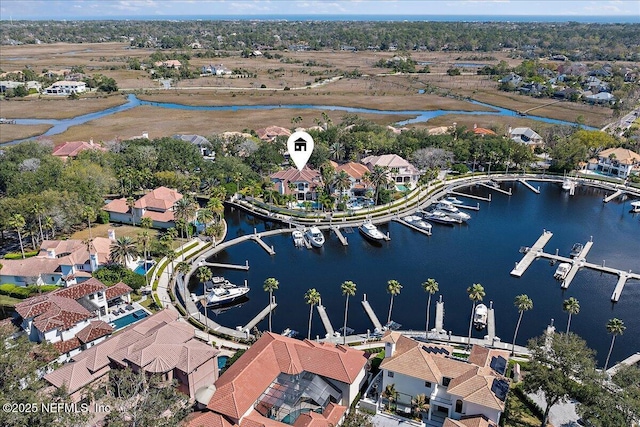 bird's eye view featuring a water view and a residential view