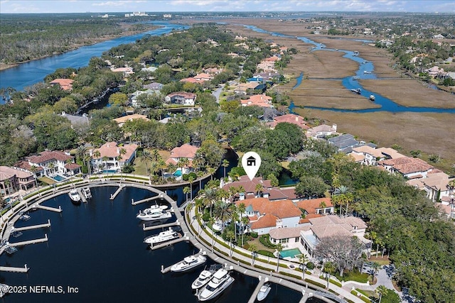 birds eye view of property with a residential view and a water view