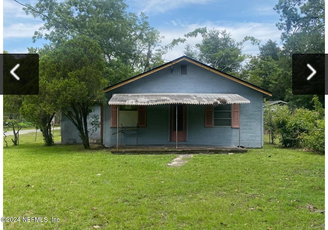 bungalow-style house with a porch and a front yard