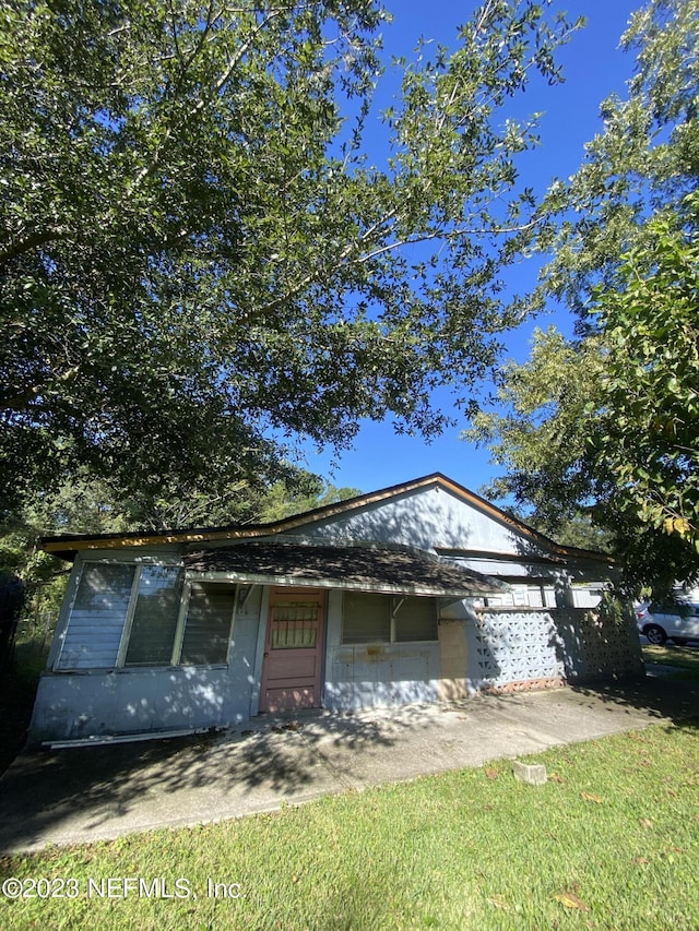 view of front of home featuring concrete block siding