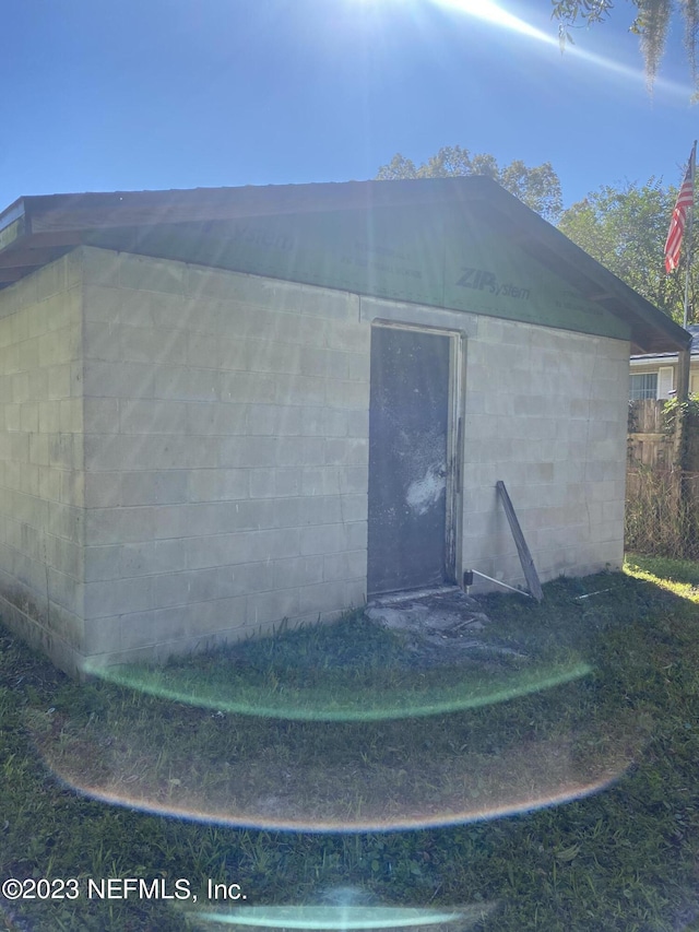 exterior space with concrete block siding