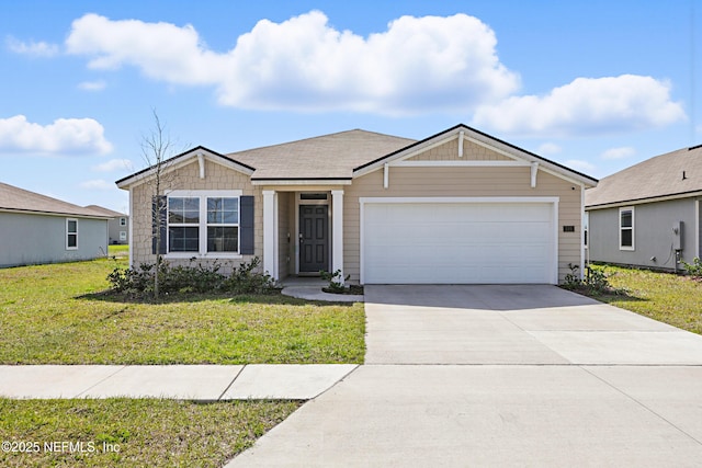 view of front of house featuring a garage, a front yard, and driveway