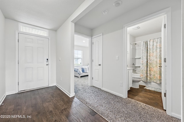 entrance foyer with wood finished floors and baseboards