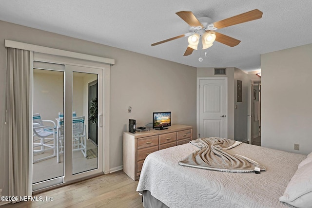 bedroom with light wood finished floors, visible vents, a ceiling fan, a textured ceiling, and access to outside