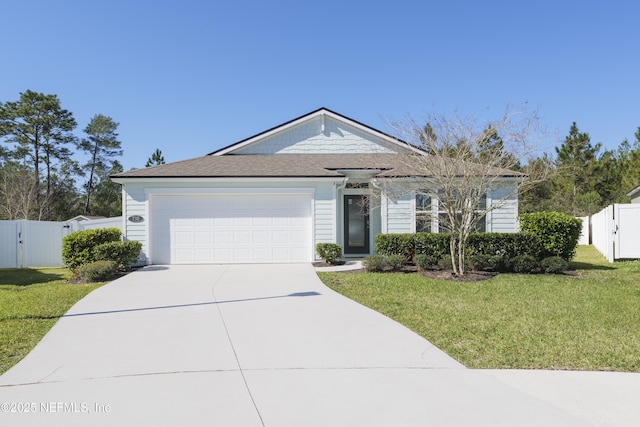 ranch-style house featuring a front lawn, fence, a garage, driveway, and a gate