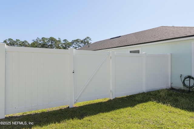 view of yard featuring a gate and fence