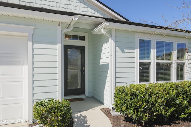 entrance to property with an attached garage