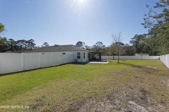 view of yard featuring a patio and a fenced backyard