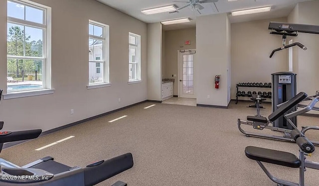 gym featuring baseboards