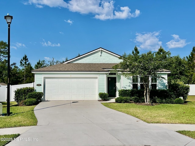 738 Seville Pkwy, Saint Augustine, FL 32086 - single story home with a front yard, a garage, driveway, and fence
