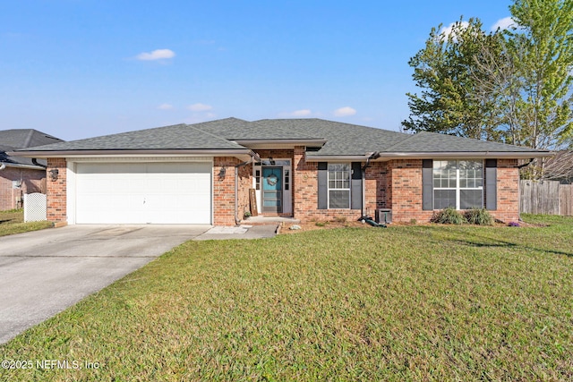 single story home with a front lawn, concrete driveway, brick siding, and an attached garage