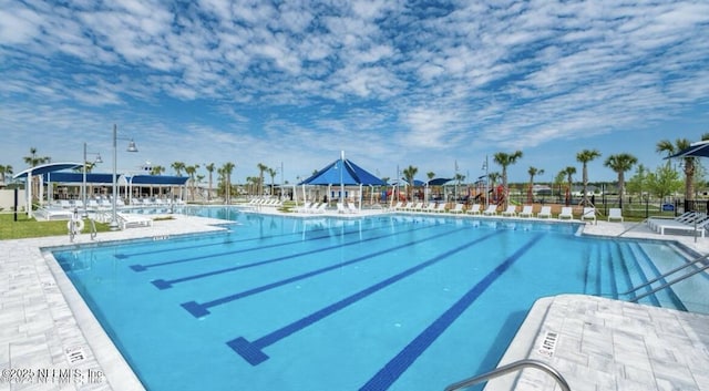 community pool with a patio area