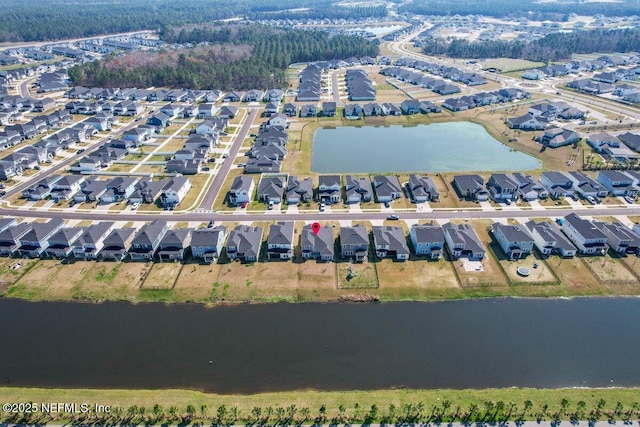 aerial view with a residential view and a water view