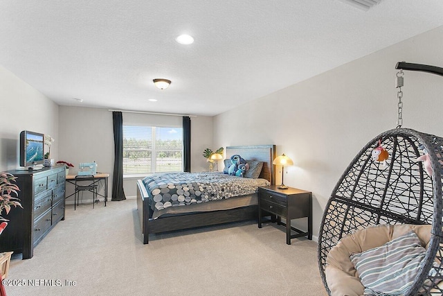 bedroom with carpet floors, a textured ceiling, and baseboards