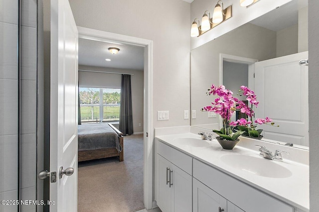 ensuite bathroom with a sink, ensuite bathroom, and double vanity