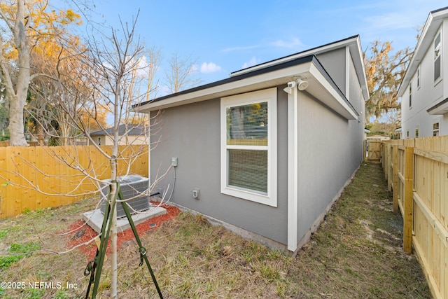 8311 Dandy Ave, Jacksonville, FL 32211 - view of home's exterior with central AC and a fenced backyard