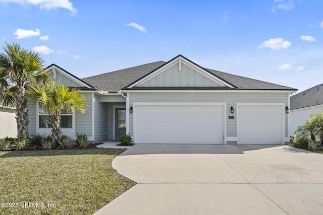 ranch-style house featuring a shingled roof, concrete driveway, an attached garage, board and batten siding, and a front yard