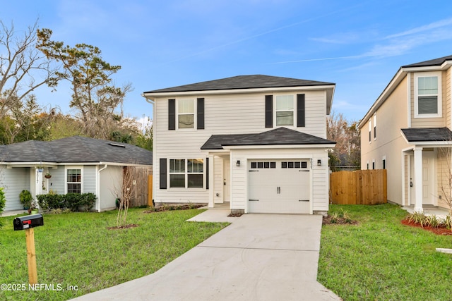 traditional-style house featuring a garage, fence, driveway, and a front lawn