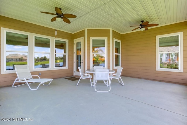 view of patio / terrace with a ceiling fan and outdoor dining space