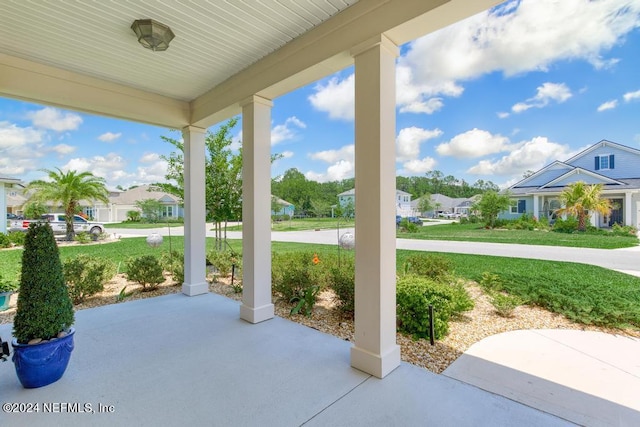 view of patio / terrace featuring a residential view and a porch