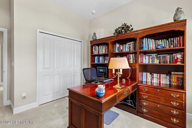 office space featuring light colored carpet and baseboards