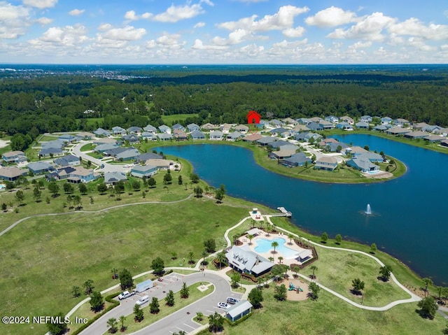 aerial view featuring a residential view, a water view, and a wooded view