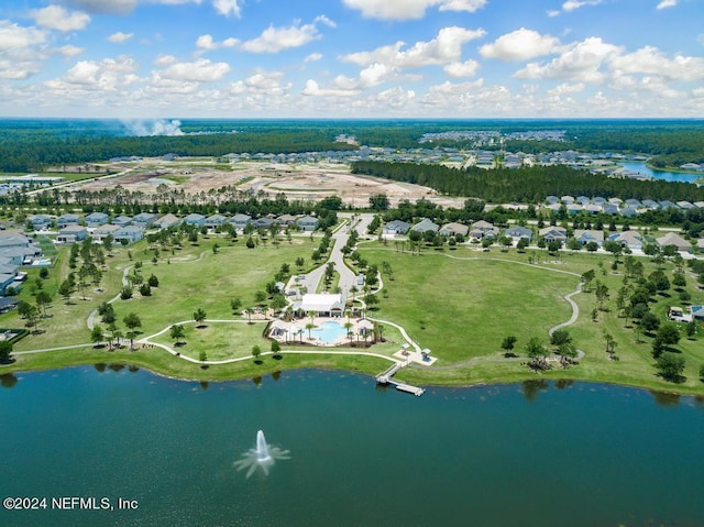 drone / aerial view featuring a residential view and a water view