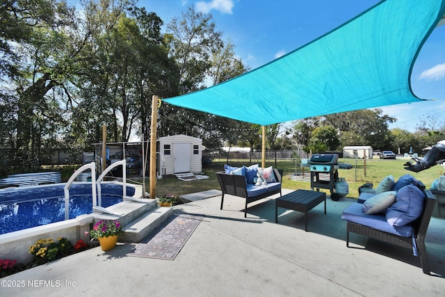 view of patio / terrace with a storage shed, an outdoor structure, a fenced backyard, and an outdoor living space