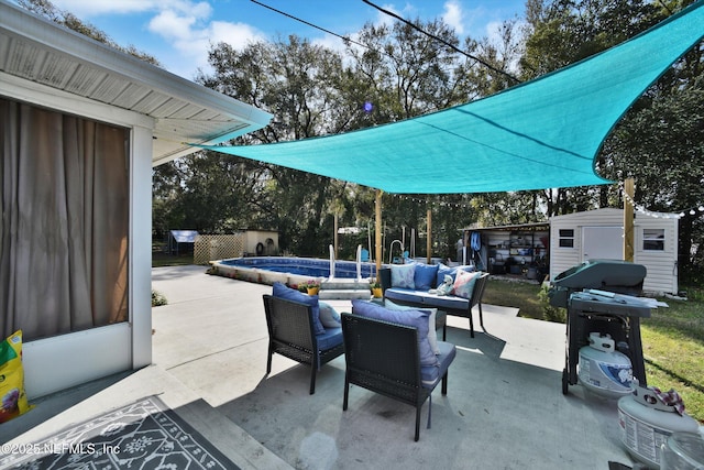 view of patio featuring outdoor lounge area, a grill, an outdoor structure, an outdoor pool, and a storage unit