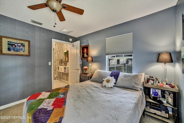 carpeted bedroom with baseboards, ceiling fan, visible vents, and wallpapered walls