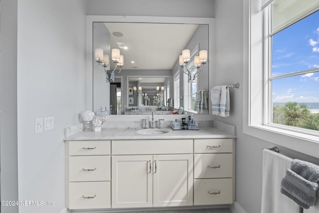 bathroom featuring vanity and baseboards