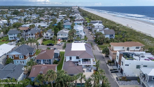 bird's eye view featuring a water view, a residential view, and a beach view