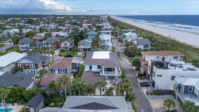 bird's eye view featuring a residential view, a water view, and a beach view