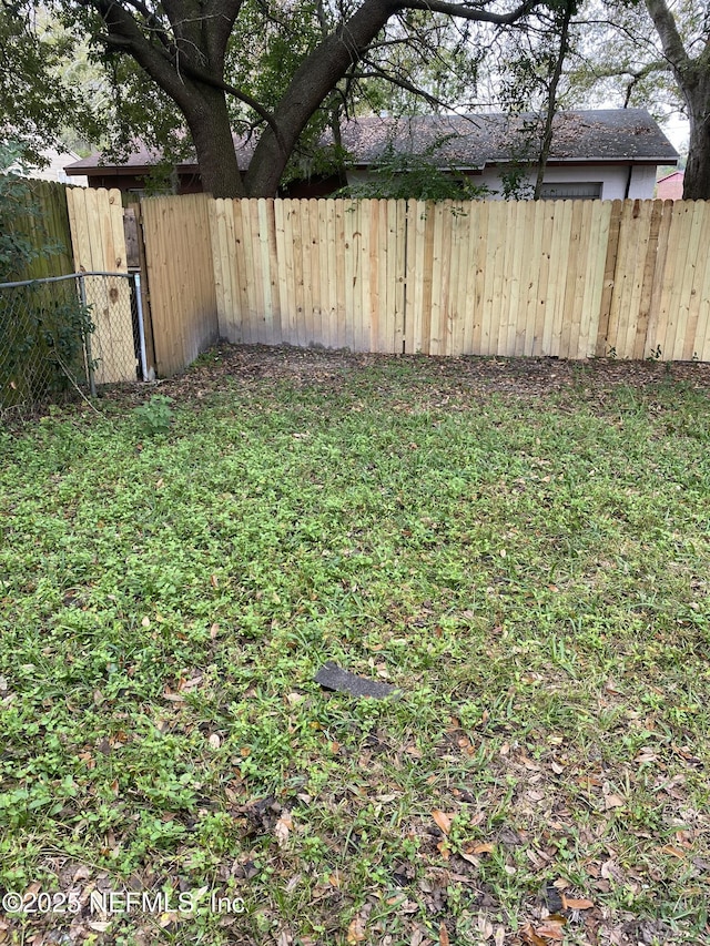 view of yard featuring fence