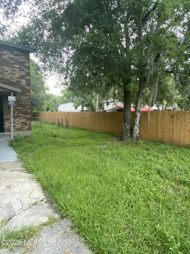 view of yard with fence