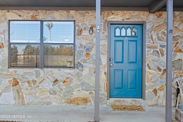 view of exterior entry with stone siding