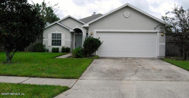 ranch-style home featuring a garage, concrete driveway, a front lawn, and stucco siding